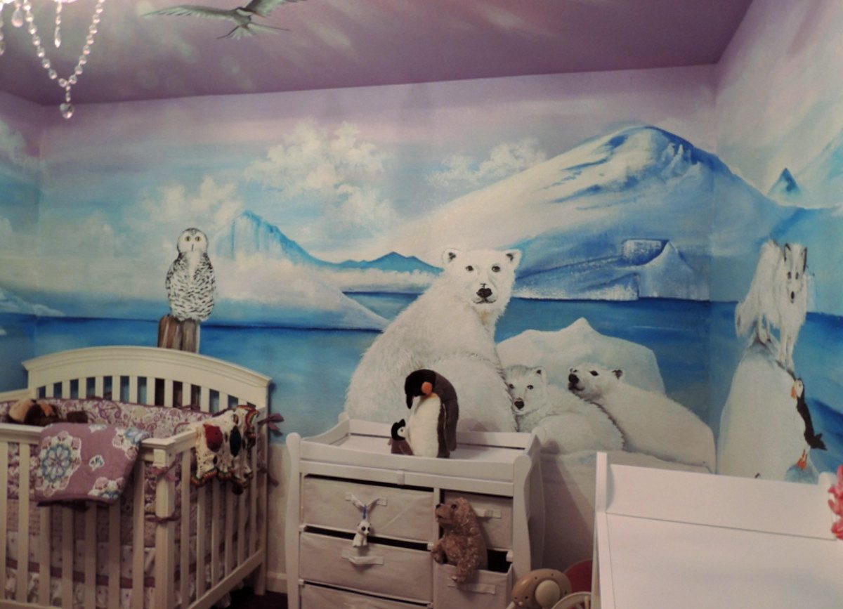 Mural of North Pole animals in a baby room