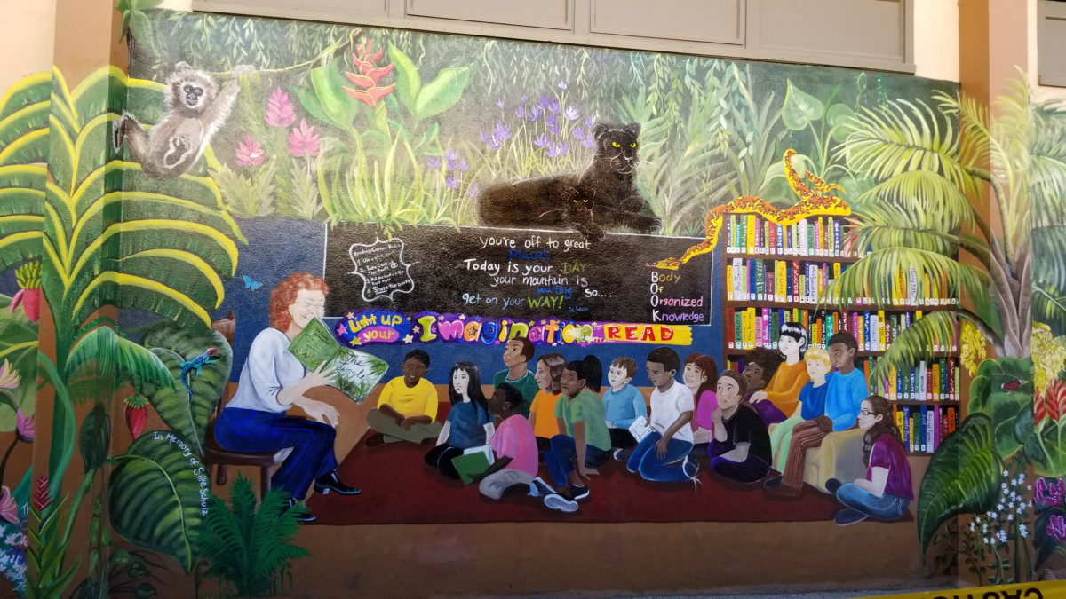 Mural of a teacher reading to the children in an elementary school in Stockton, CA