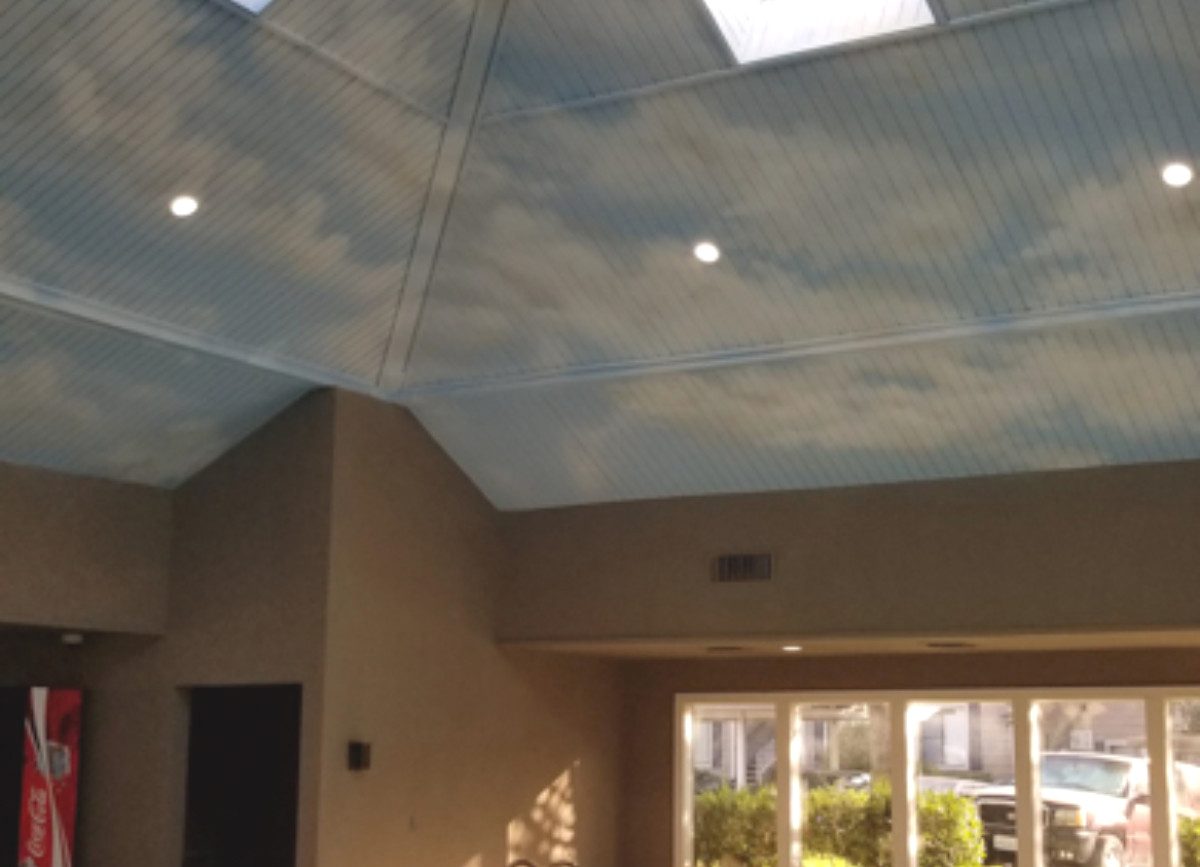 Mural of clouds on the ceiling of an Indoor pool