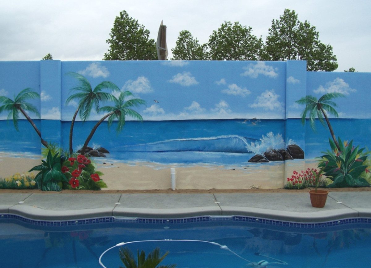 Tropical mural on retaining wall next to pool