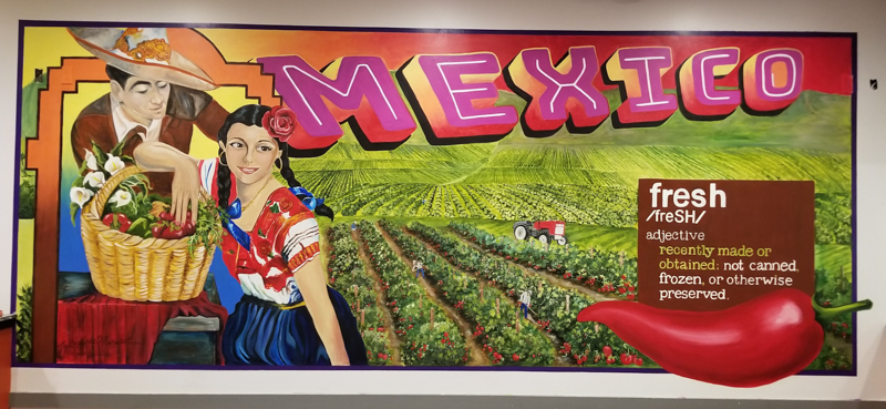 Mural of woman, man, farmland on exterior wall of Cincos Tex Mex, Napa, CA