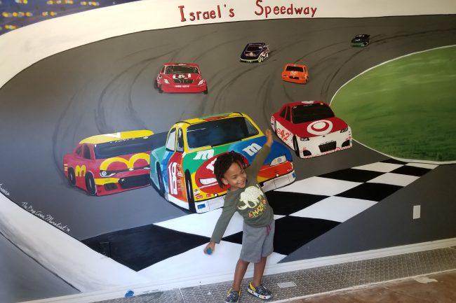 Racetrack mural in a child's room.